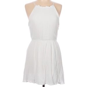 Knee length white dress with elastic waist and ties in the back